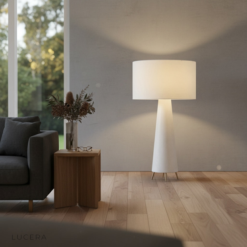 Quarters Floor Lamp as ambient lighting in a bedroom at evening, showcasing 50,000-hour LED warm glow