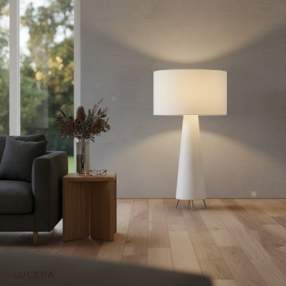 Quarters Floor Lamp as ambient lighting in a bedroom at evening, showcasing 50,000-hour LED warm glow