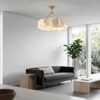 Organic petal-like alabaster chandelier in sunlit loft with high ceiling