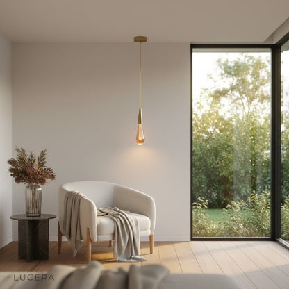 Beryl pendant light suspended over marble kitchen island with soft daylight
