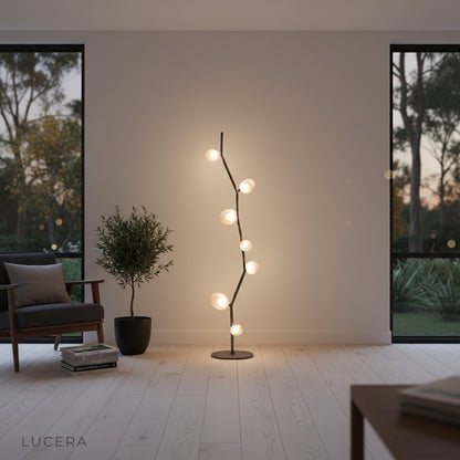 Dahlia floor lamp glowing softly in a bedroom with three color light modes