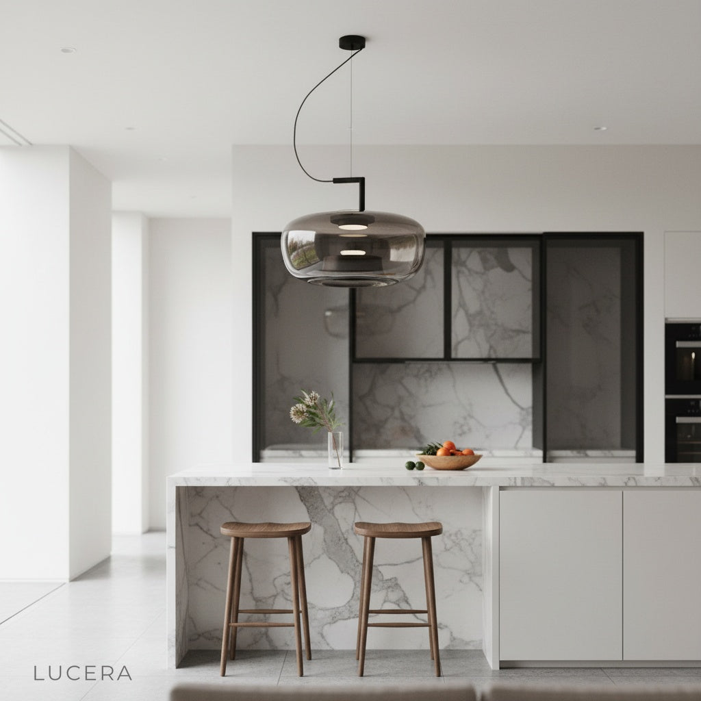 Yardang pendant light suspended over marble countertop in elegant modern kitchen setting