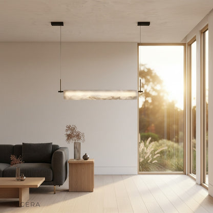 Evening lifestyle shot of the Parlor alabaster pendant light in a stylish entryway