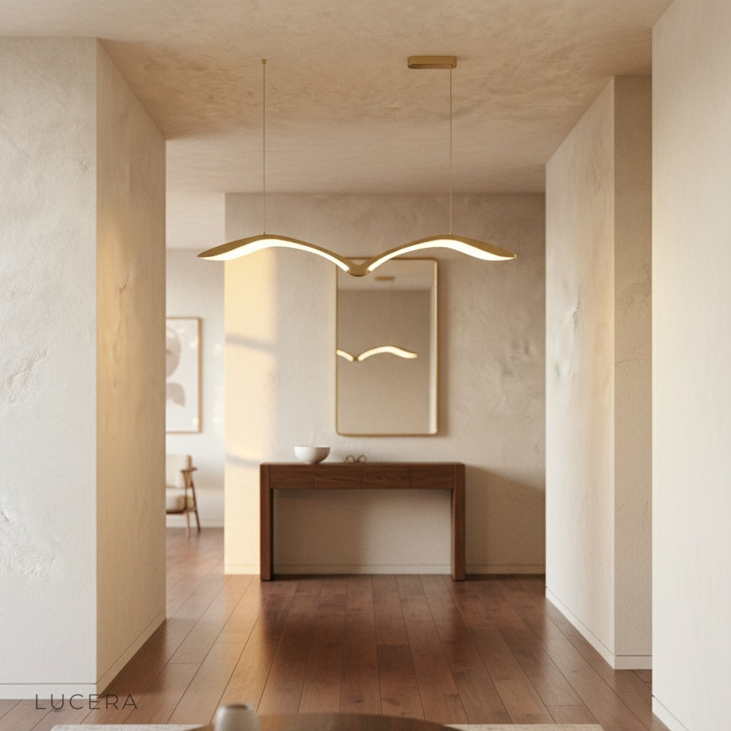 elegant Lucera chandelier illuminated at dusk in a minimalist entryway