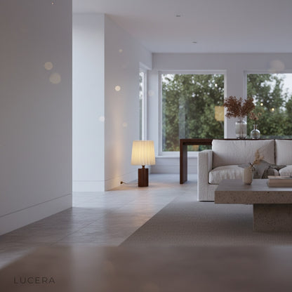 Pandora Table Lamp on bedside table in elegant guest room with soft shadows and cozy sophisticated atmosphere
