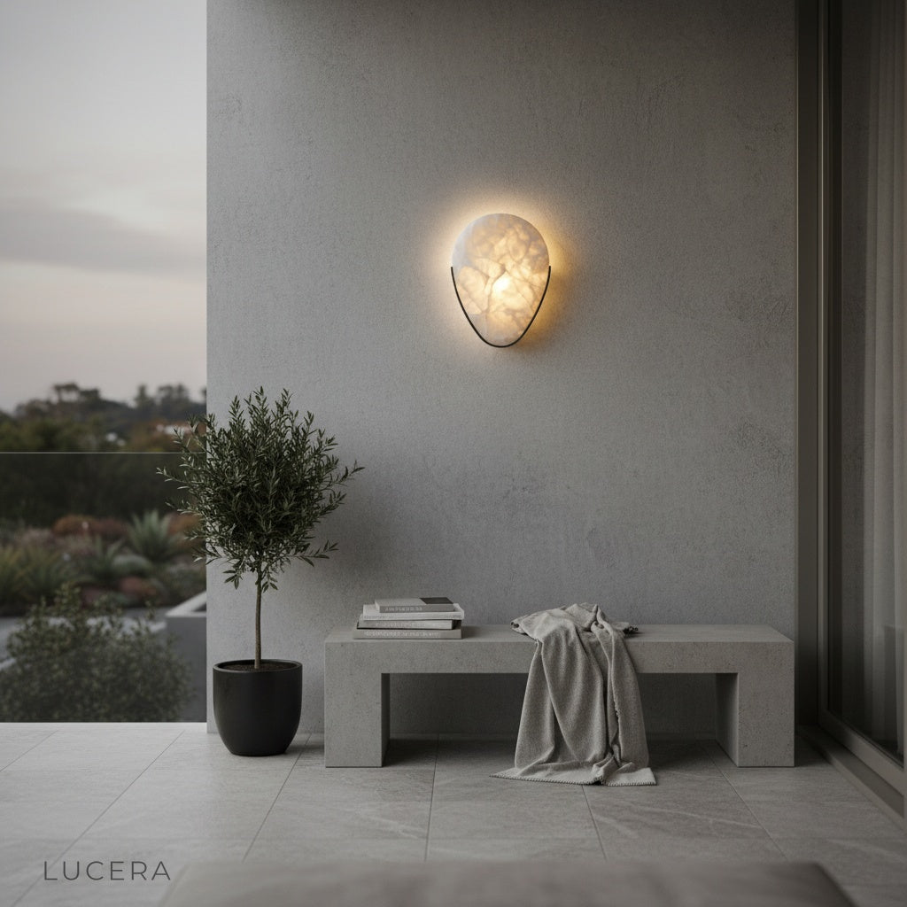 Modern living room accent wall with Borealis sconce casting a calming glow over decor