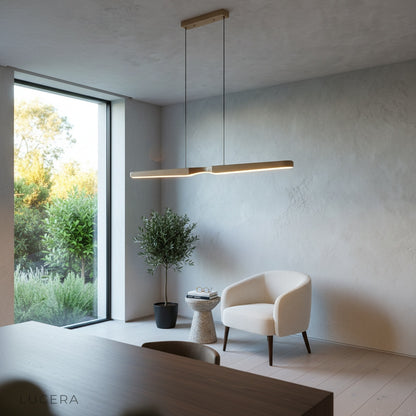Ember wood pendant light suspended above a breakfast nook with linen curtains and morning sunlight