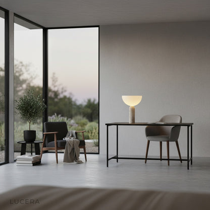 Tristan Table Lamp illuminated in cozy bedroom setting with warm bedside glow