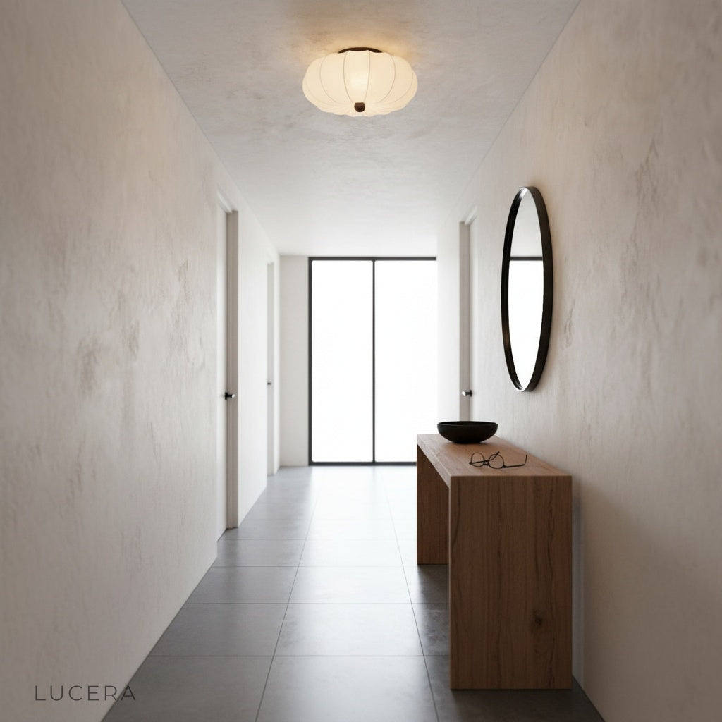 Teresa ceiling light floating above a minimalist hallway with calm evening light