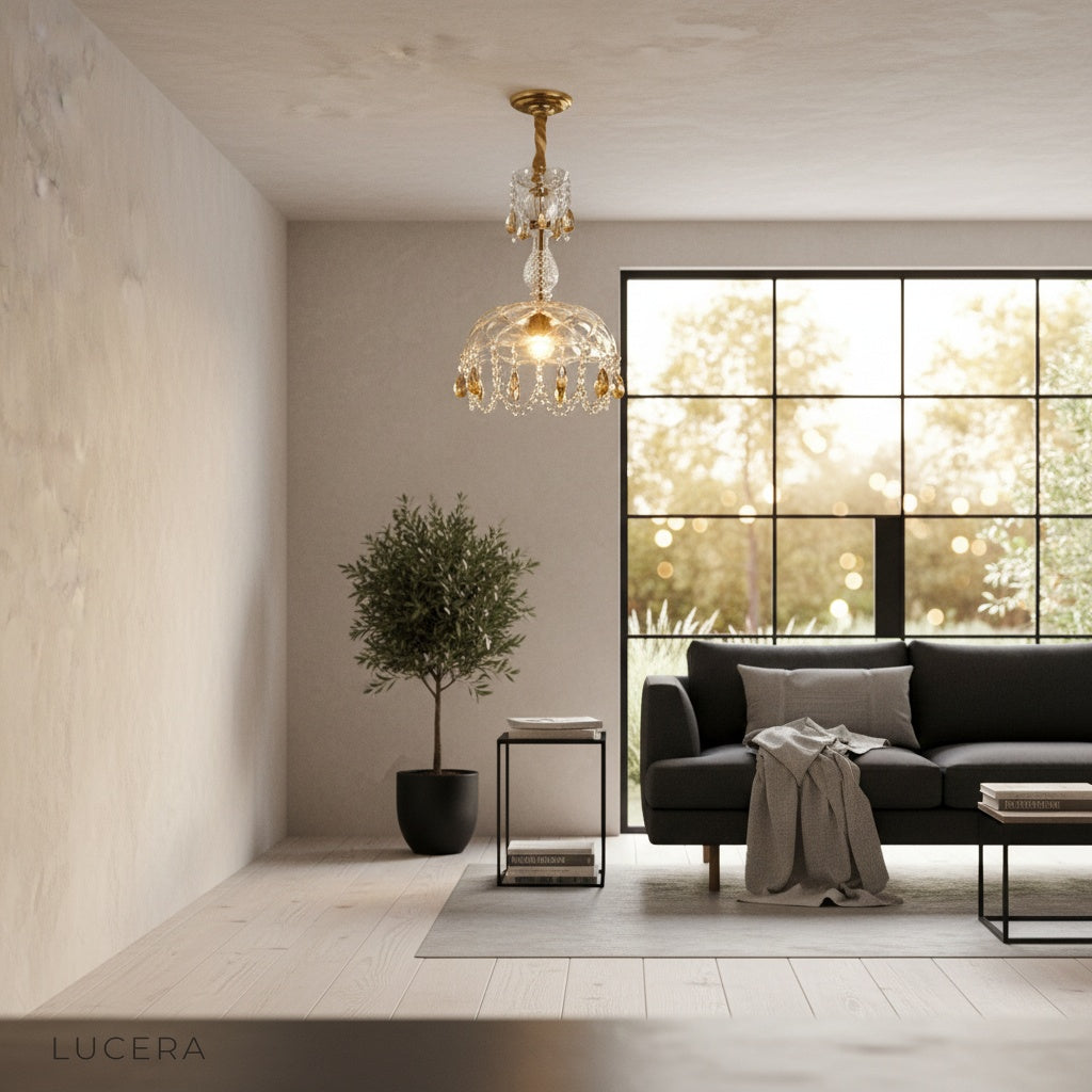 Lorcan pendant light casting soft glow in reading nook with leather armchair and bookshelf