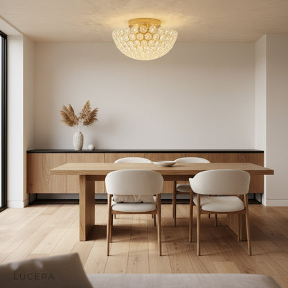 Vine ceiling light casting sparkling reflections in luxurious bedroom at night