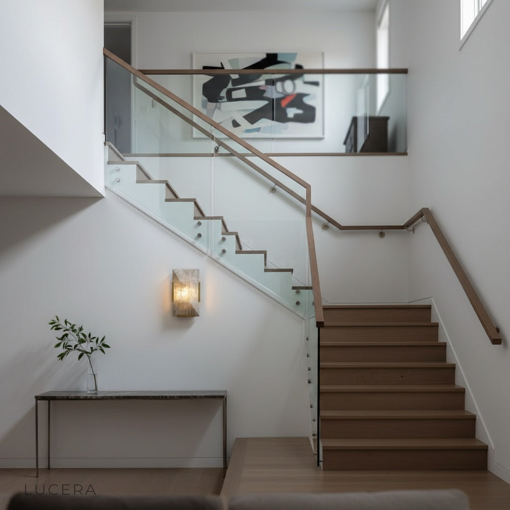 Haut-Médoc wall lamp in stairwell corner with layered stone panels glowing warmly
