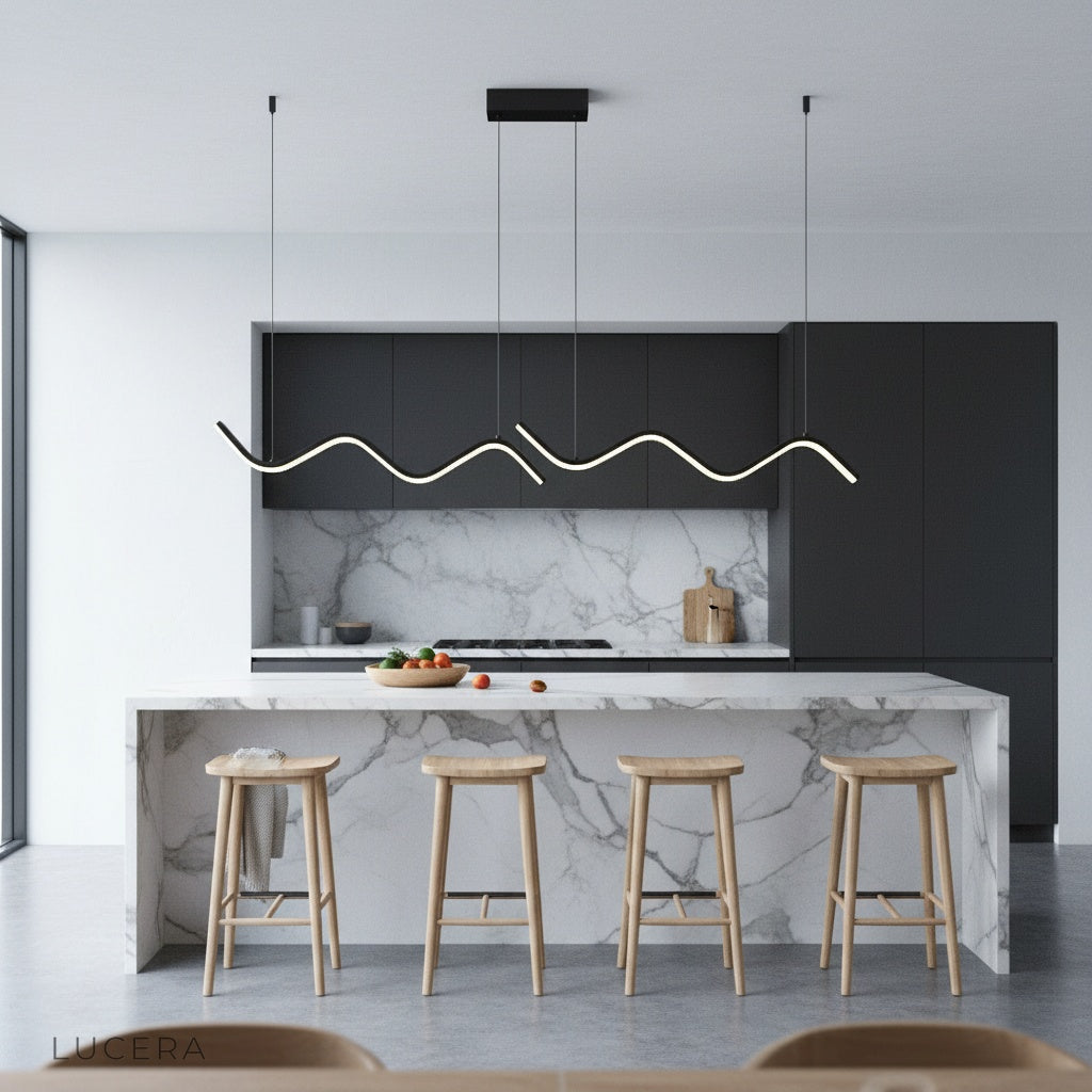 adjustable Melisande pendant light hanging over a minimalist kitchen island