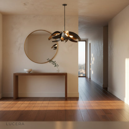 Incanto Chandelier illuminated at night in a high-ceiling living room with floor-to-ceiling windows