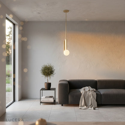 nighttime lifestyle shot of Yancy pendant light over a bedside table with warm inviting atmosphere