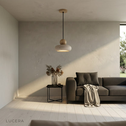 Sculptural Mensa Pendant Light illuminated in stylish dining space at dusk