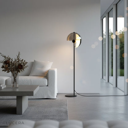 Oubliette Floor Lamp sculptural silhouette against textured wall at night