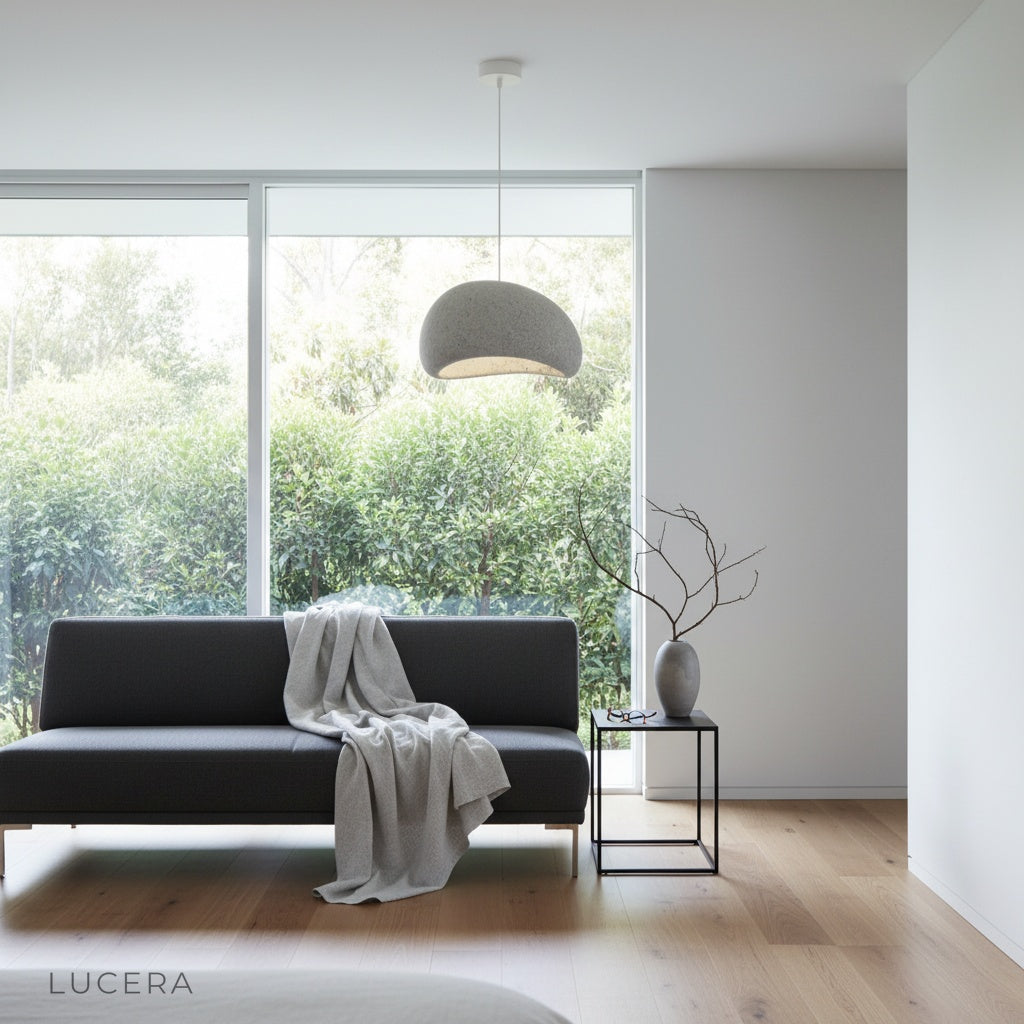 nighttime lifestyle shot of sand pendant lamp illuminating rustic living space