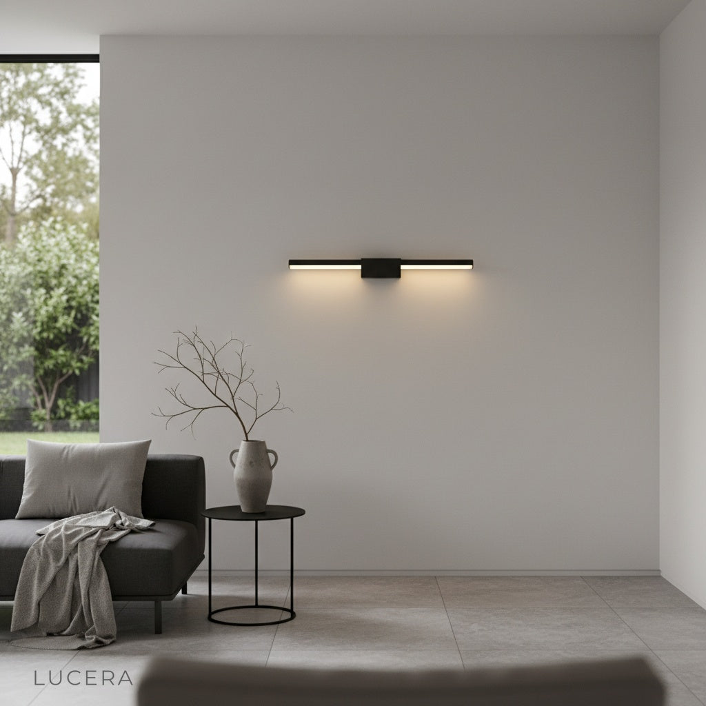 Fiamma wall lamp above vanity mirror in spa-like bathroom setting
