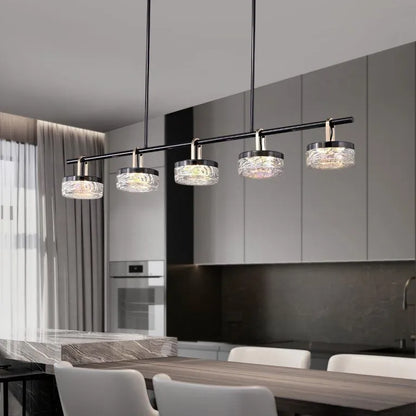 Aquamarine Linear Chandelier over modern kitchen island with pearl black and champagne gold finish